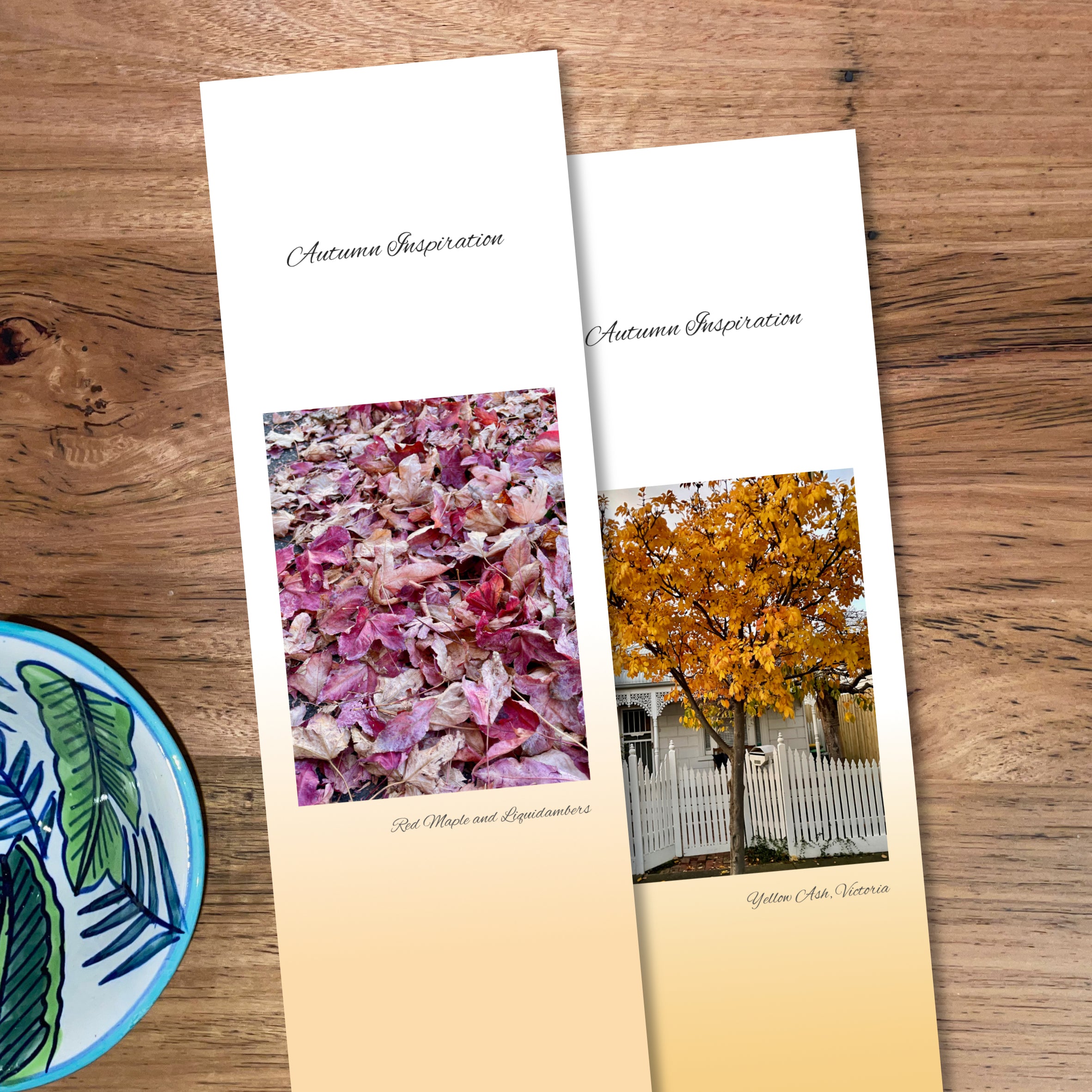 Two bookmarks side by side, one with fallen pink & purple leaves and another with a yellow ash tree in autumn as their feature photos