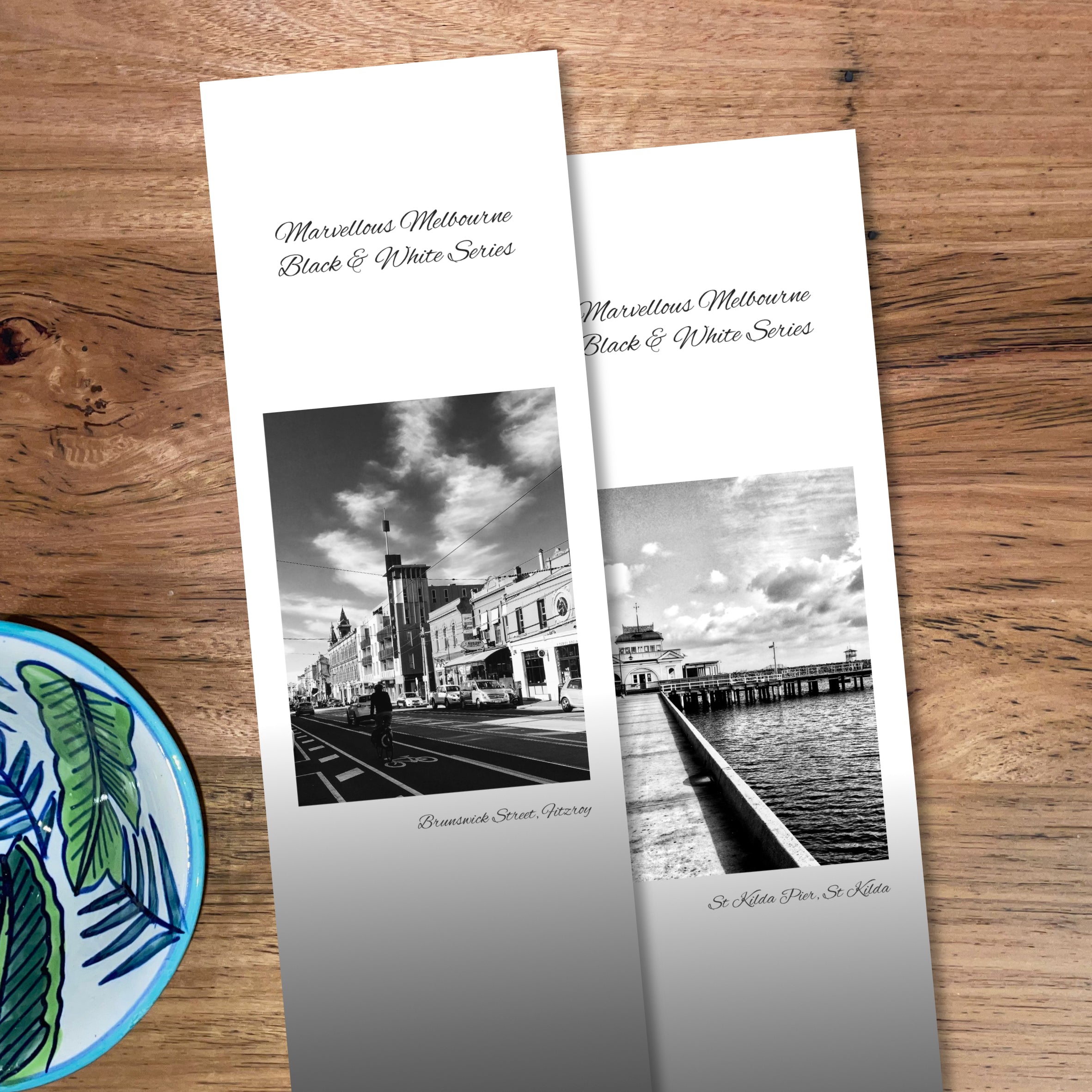 Two B&W bookmarks side by side, one with a cool urban street view and another with old pier and pavilion as their feature photos