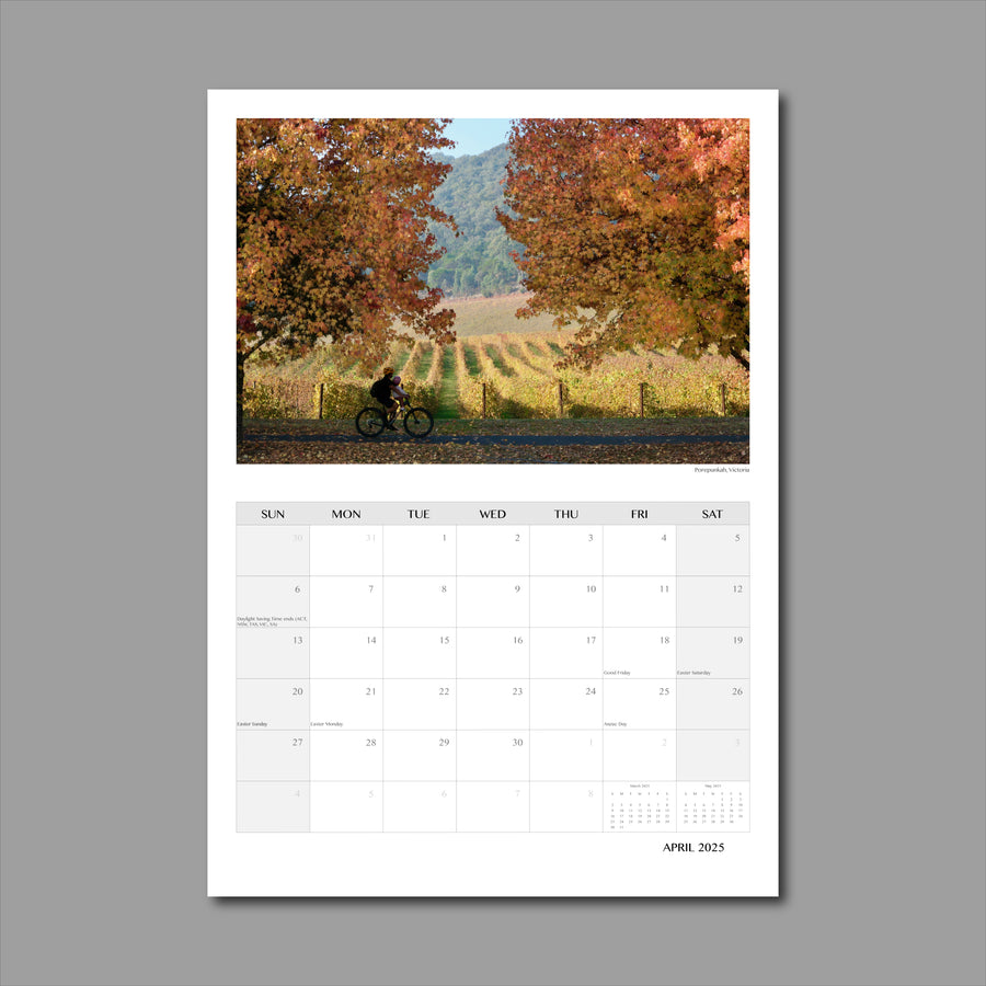 A3 Wall Calendar: Captivating Vistas featuring a lone rider riding by amidst colourful autumn foliage  and vineyards in the distance