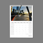 A4 Wall Calendar: Marvellous Melbourne featuring a bride and groom posing for photos on bridge over the river  at dusk