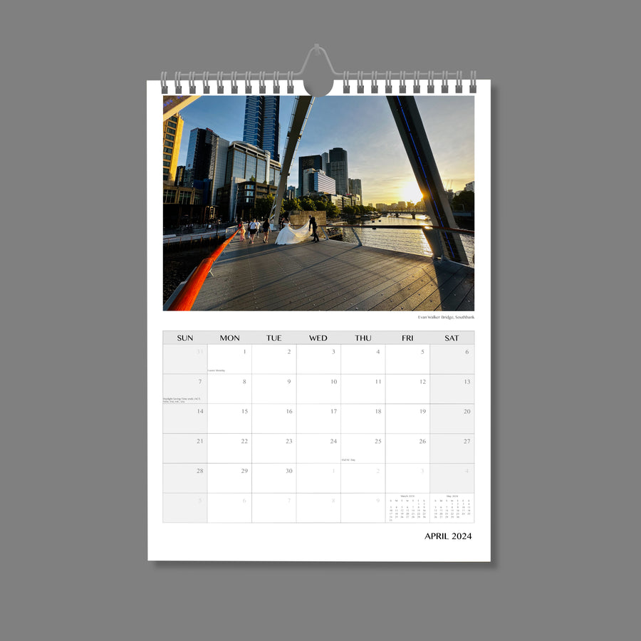 A4 Wall Calendar: Marvellous Melbourne featuring a bride and groom posing for photos on bridge over the river  at dusk