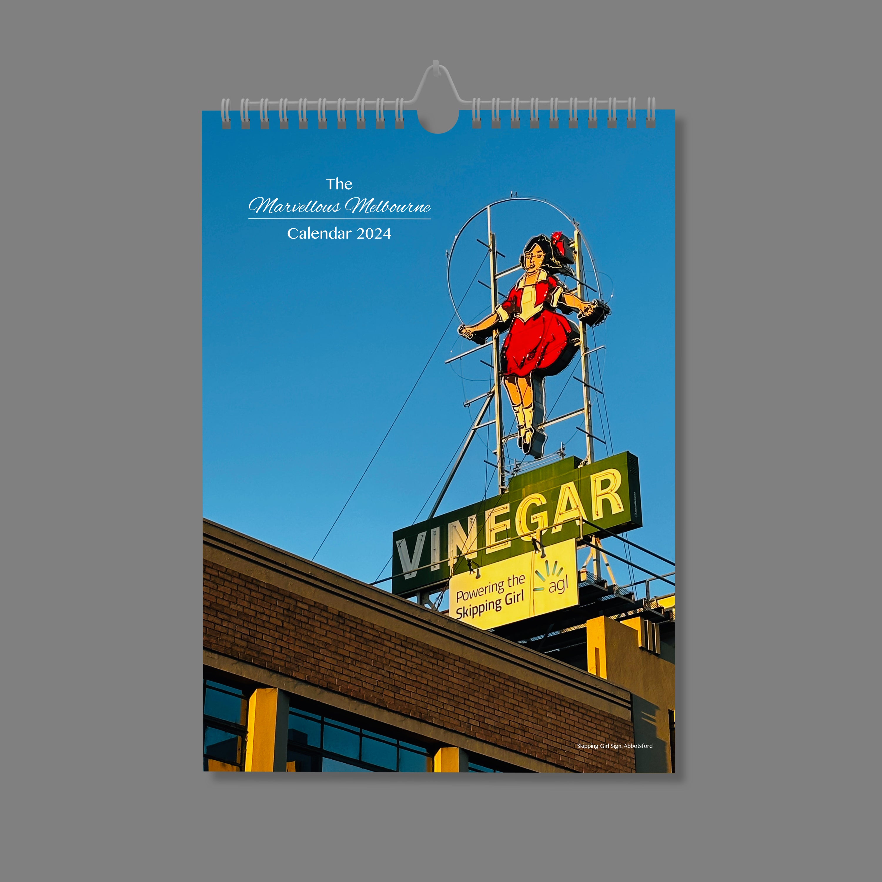 A4 Wall Calendar: Marvellous Melbourne featuring Skipping Girl sign in glorious sunlight against a blue sky