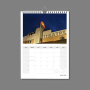 A4 Wall Calendar: Marvellous Melbourne featuring an art deco theatre with classic sun sign glowing against a darkening blue sky