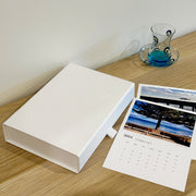 sturdy white box with lid closed and a5 calendar cards on sideboard