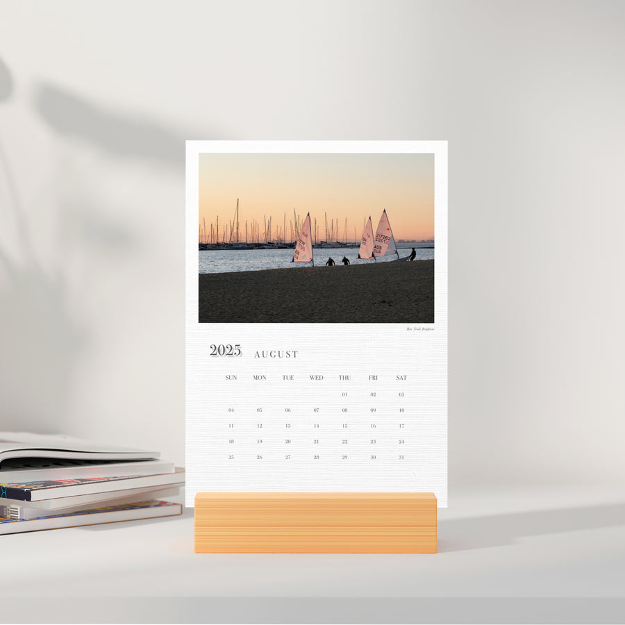 A5 Cards Calendar Moments of Melbourne displaying the month of August in a small stand, on a sideboard