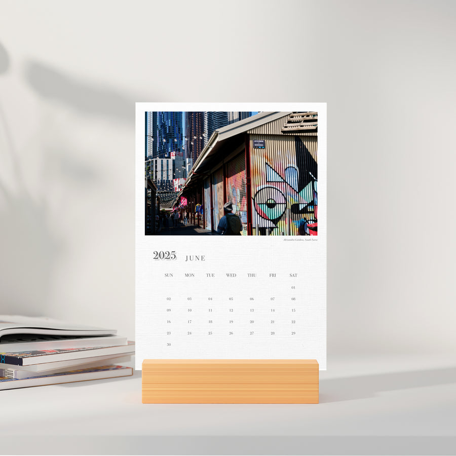 A5 Cards Calendar Moments of Melbourne displaying the month of June in a small stand, on a sideboard