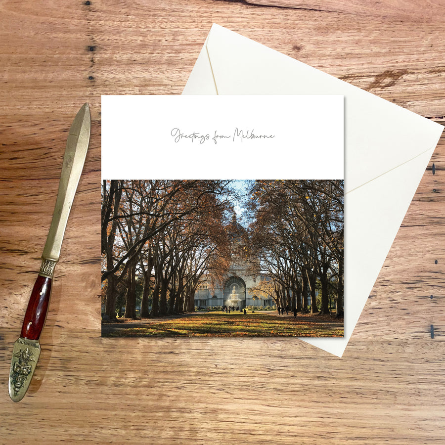 Greeting Card Melbourne: Royal Exhibition Building,  a small square card featuring the grand building and majestic plane trees