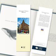 A two sided 200 x 60 bookmark in colour displayed inside a book, featuring a tall art deco building with a modern day tram in front