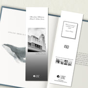 A two sided 200 x 60 bookmark in B&W displayed inside a book, featuring the art deco exterior of the theatre with grey background variant