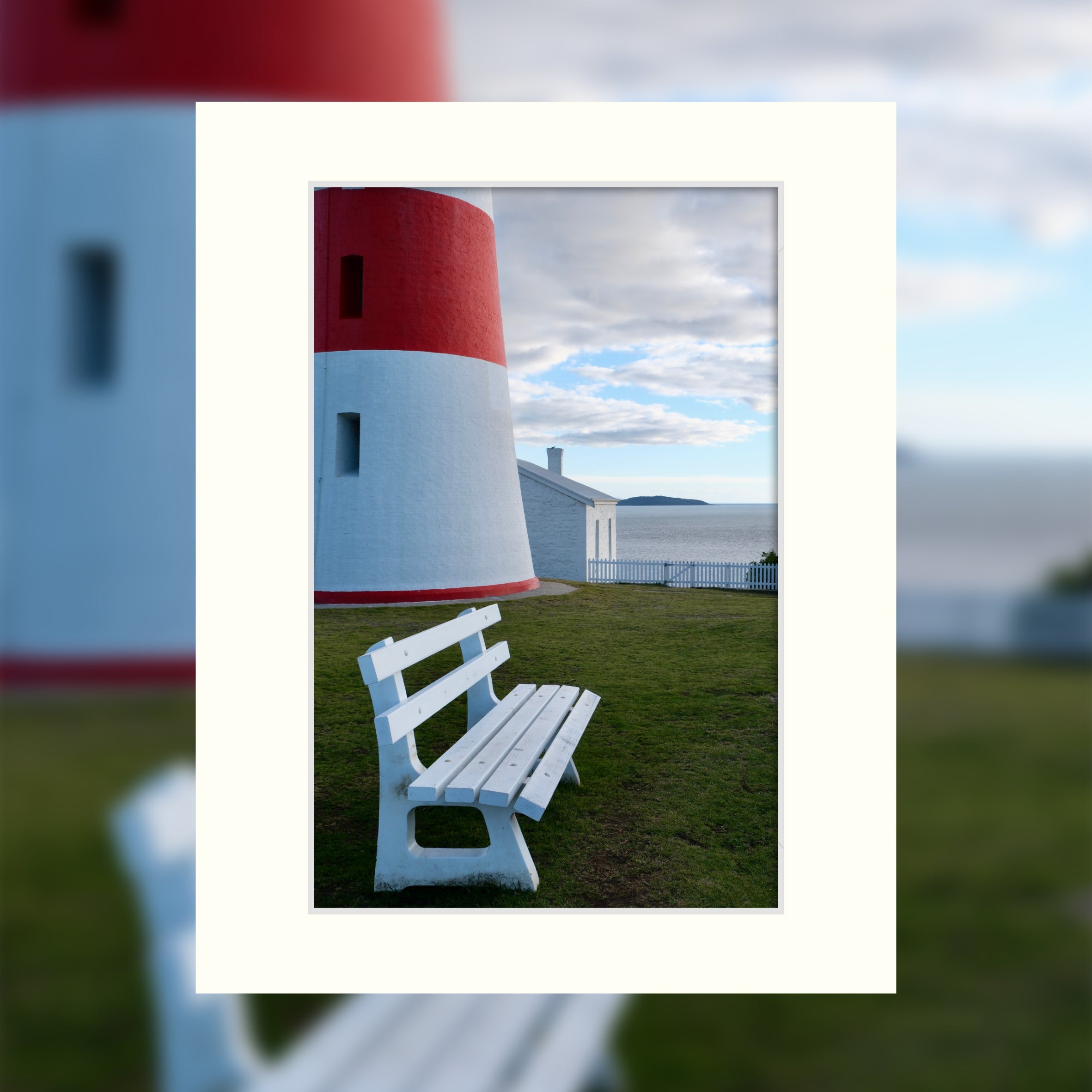 A ready to frame print of lighthouse and keeper's cottage in front of the ocean