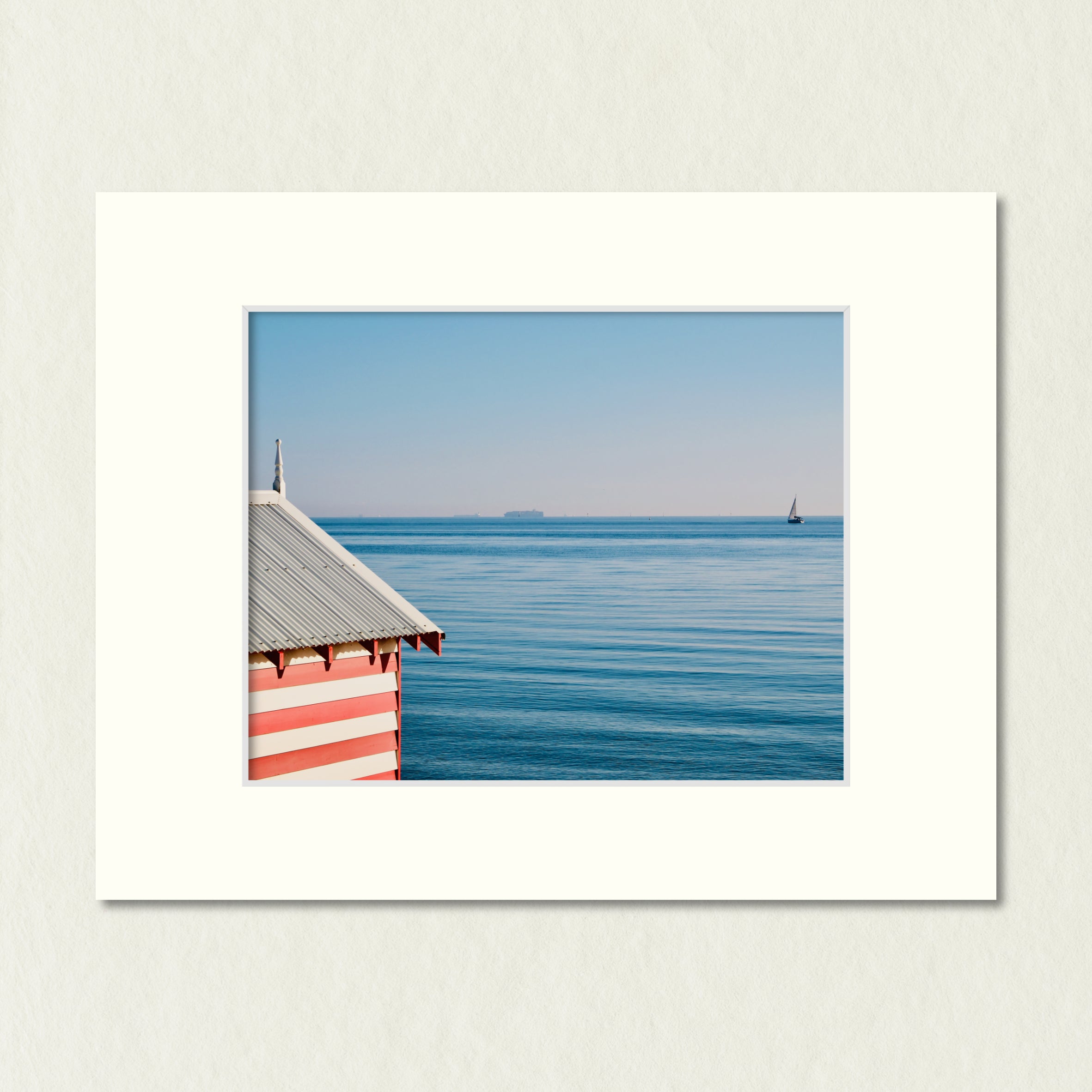 Ready to Frame Print: Candy Striped Bathing Box - a frame mount containing a photo of a red and white bathing box against vivid blue waters