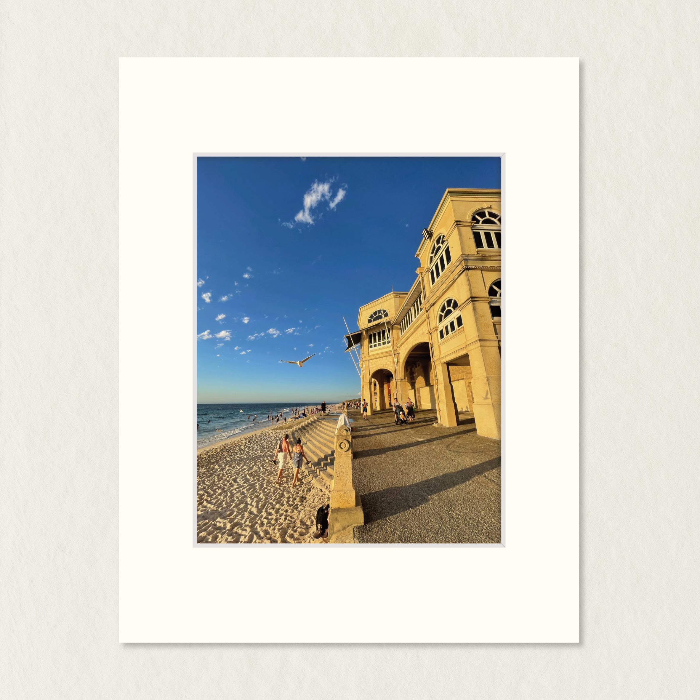 Ready to Frame Print: Cottesloe - frame mount containing a photo of a famous building on the coast, looking golden against the beach