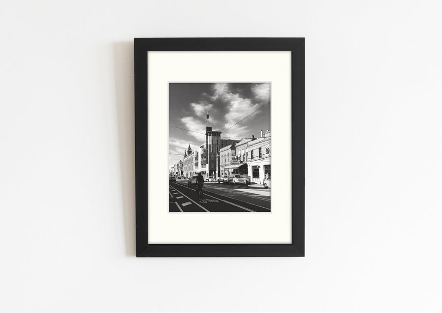 Frame mount with B&W print of Brunswick St, Fitzroy in finalised picture frame hanging on wall