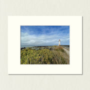 Ready to Frame Print: Griffiths Island Lighthouse - a frame mount containing a photo of a lighthouse with grassland and a stormy sky