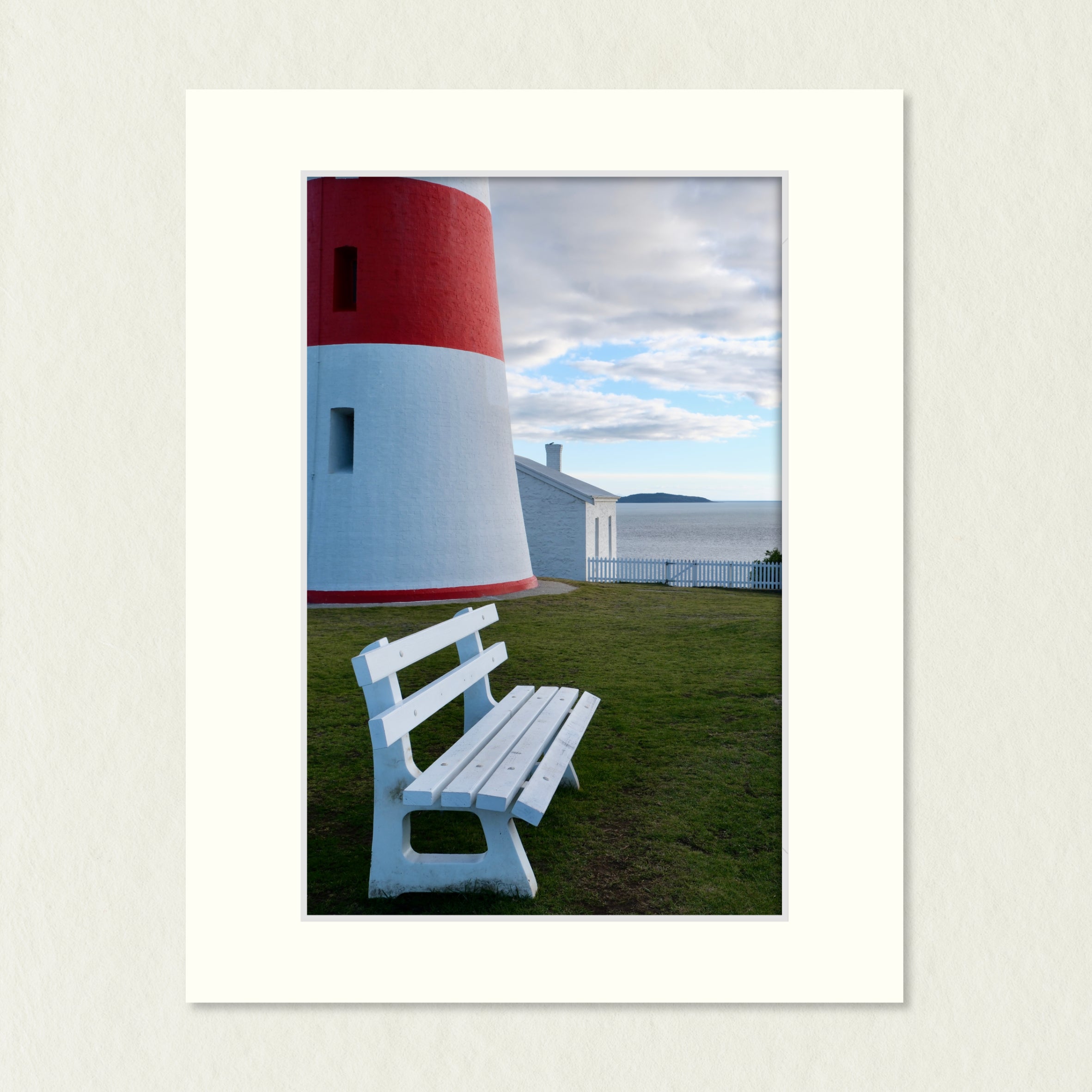 Ready to Frame Print: Low Head Lighthouse - a frame mount containing a photo of part of a red & white lighthouse and a bench seat