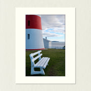 Ready to Frame Print: Low Head Lighthouse - a frame mount containing a photo of part of a red & white lighthouse and a bench seat