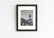 Frame mount with B&W print of Melbourne’s famous Skipping Girl sign in finalised picture frame hanging on wall